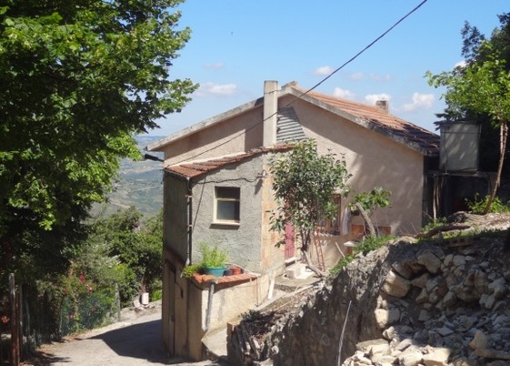 Two houses (stone) and a barn with garden. One house is inhabitable. 3km to town. 