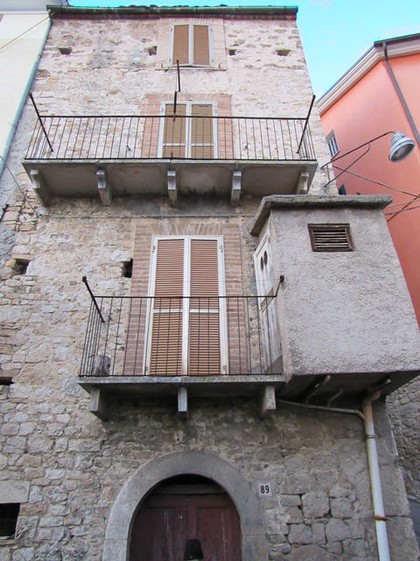 Stone town house in the center of a small hamlet. 