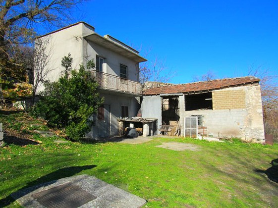 Detached countryside house with sun terrace offering lake and mountain views.